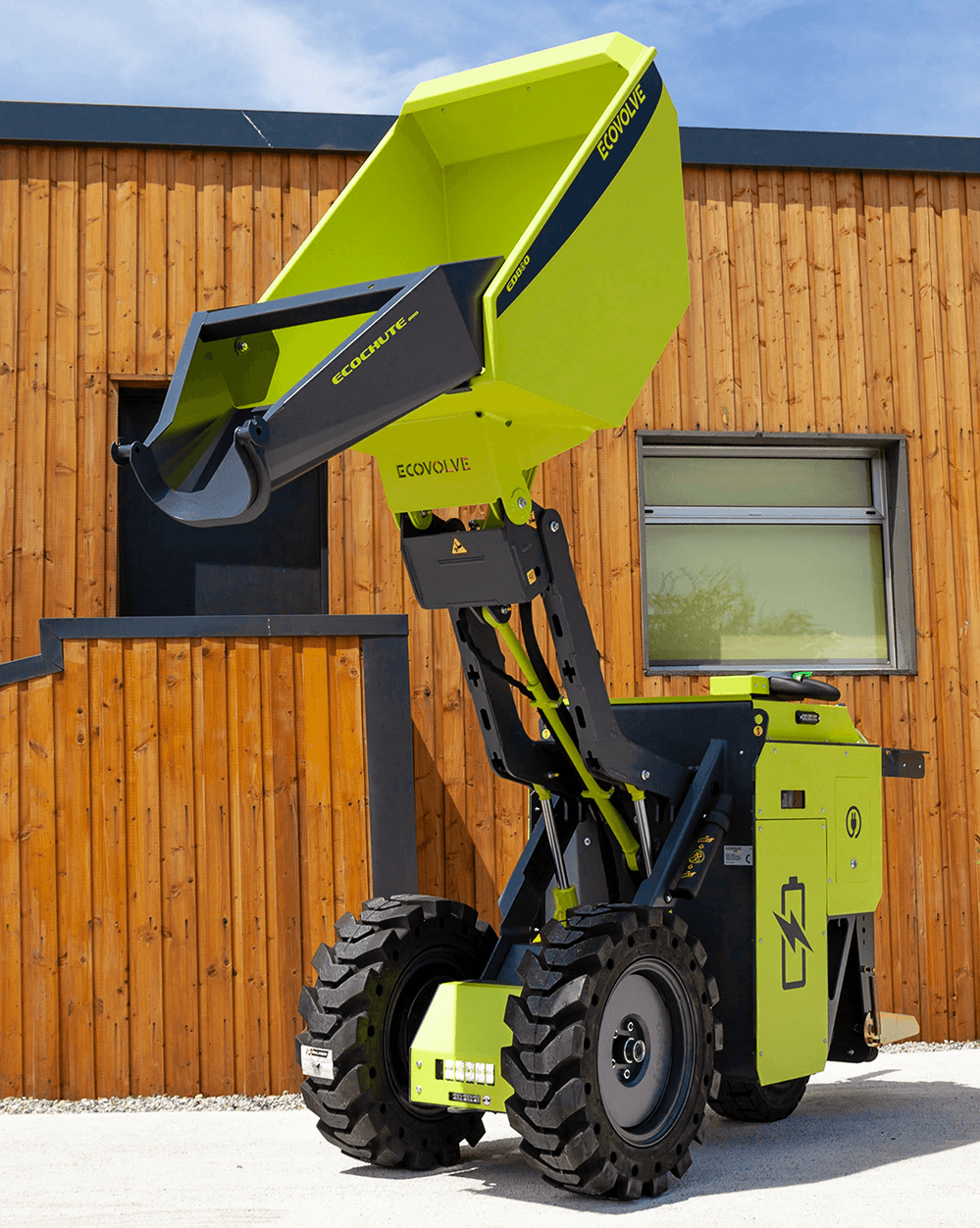 green electric dumper with concrete chute attached