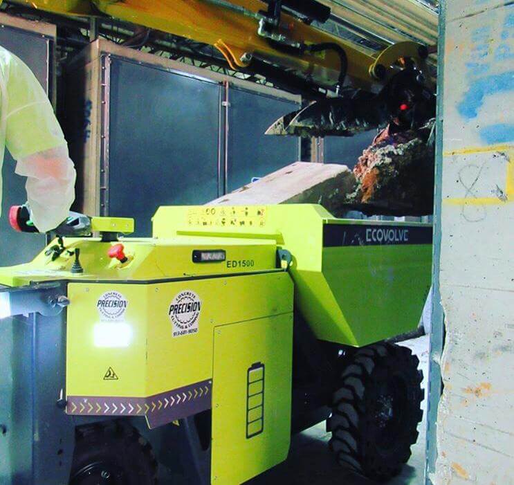 green electric dumper with digger grappler